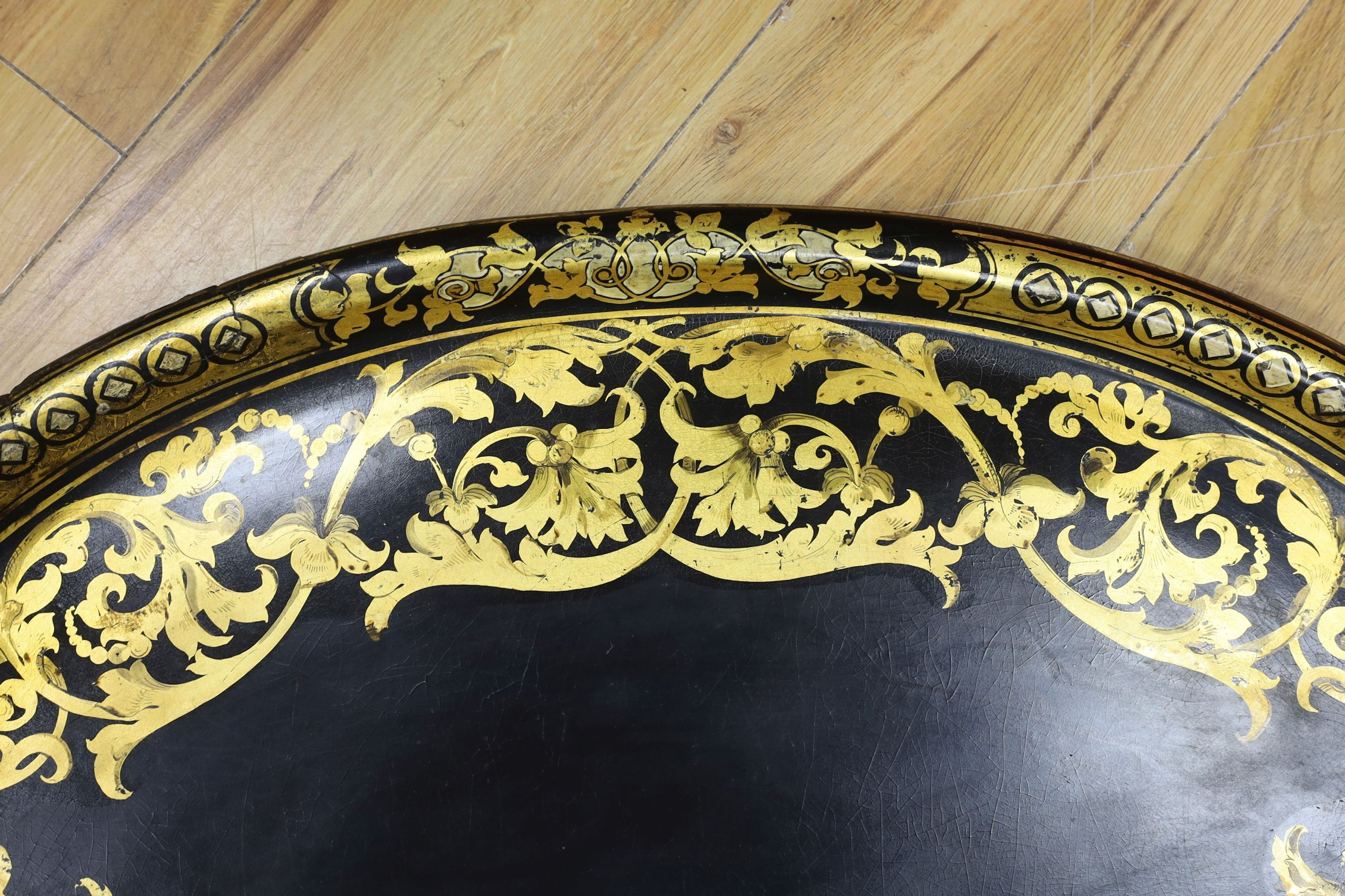 A large Victorian oval papier mache tray, 66cms wide.
